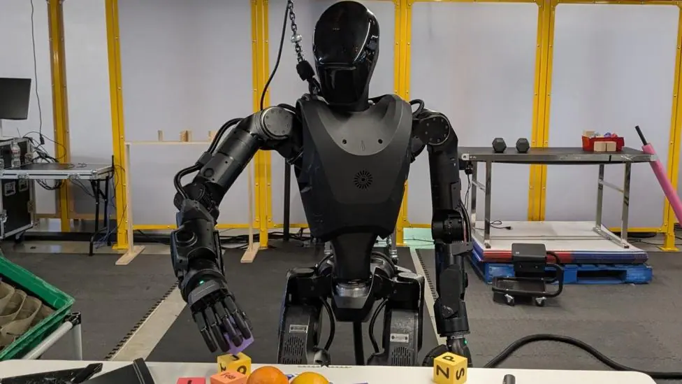 The all black Phantom robot handles building blocks.