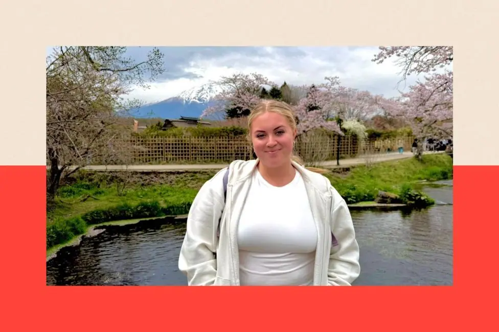 Lauren standing by a lake