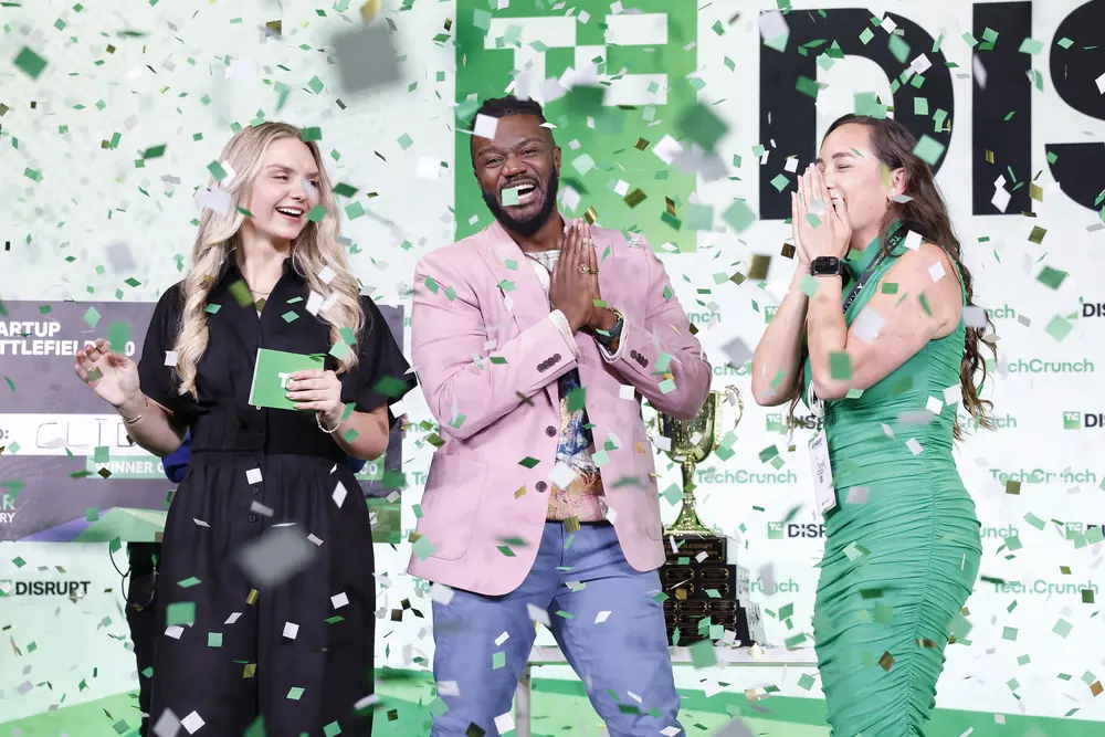 Kevin A. Damoa, Founder & CEO, Glīd, Claire Kroft and Ankit Malhotra, winners of the Startup Battlefield 2025, pose onstage during day three of TechCrunch Disrupt 2025 at Moscone Center on October…