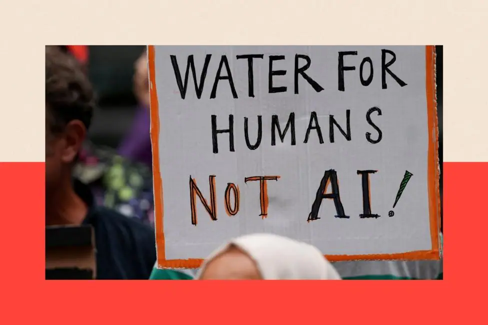People holding placards against the approval of a data centre in the government's redevelopment plans for Brick Lane which reads: "Water for humans not AI"