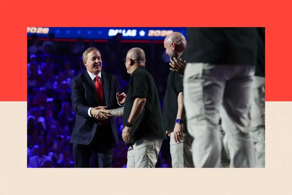 Texas Republican Senate candidate, Texas Attorney General Ken Paxton shakes hands with U.S. Border Patrol Agents on stage