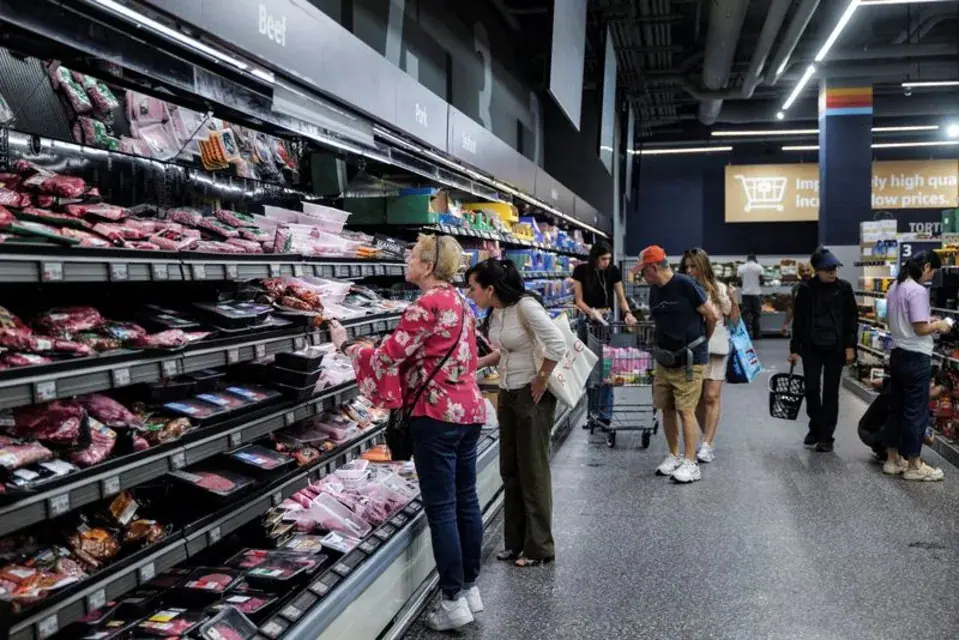 People shop for groceries in New York City, U.S., August 26, 2026. REUTERS/Jeenah Moon · Reuters