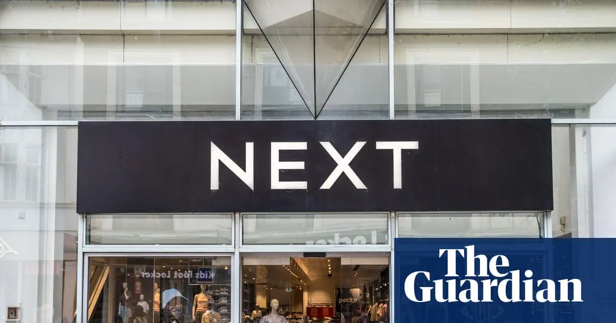 Next forecasts bigger profits after hot weather lifts sales