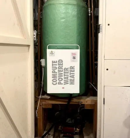 A heata unit in a cupboard in a home