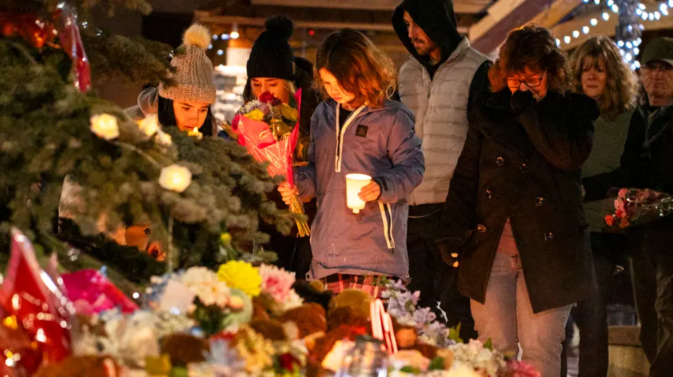 Community members mourn during a candlelight vigil for the victims of Tumbler Ridge Secondary School where a mass shooting took place a day earlier in the small town of Tumbler Ridge, British…