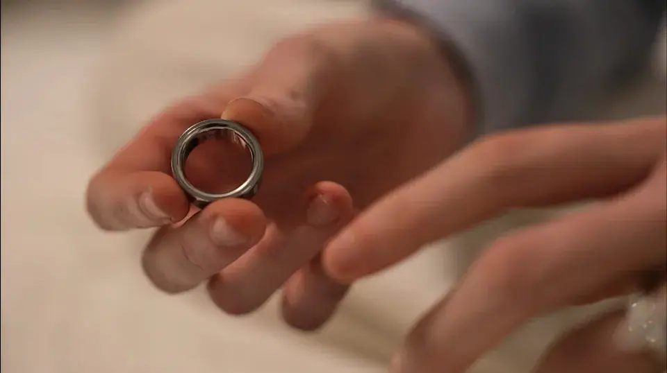 Middle school teacher Kate Stoye puts on an Oura ring, a wearable sleep tracking device, Wednesday, Jan. 7, 2026, in Hiram, Ga. (AP Photo/Emilie Megnien) · Yahoo Finance · ASSOCIATED PRESS
