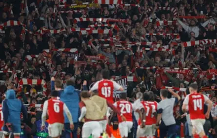 Arsenal players celebrate in front of their joyous fans during the Champions League 2025/26 semi-final second leg match against Atlético Madrid