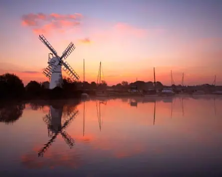 Sunrise over a windmill on the Norfolk Broads