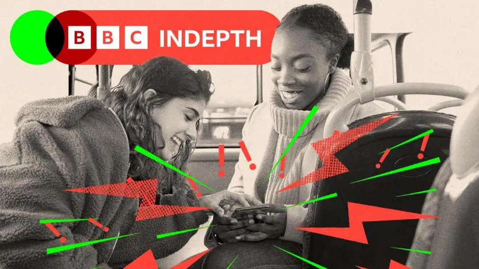 Two teenage girls laugh as they look at a phone together. One wears a wite polo neck jumper and the other wears a darker fleece. The image is black and white and there are lightning bolts and…