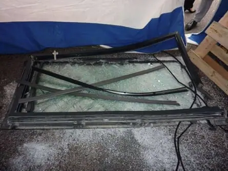 A smashed window pane from the Corniche luxury development.