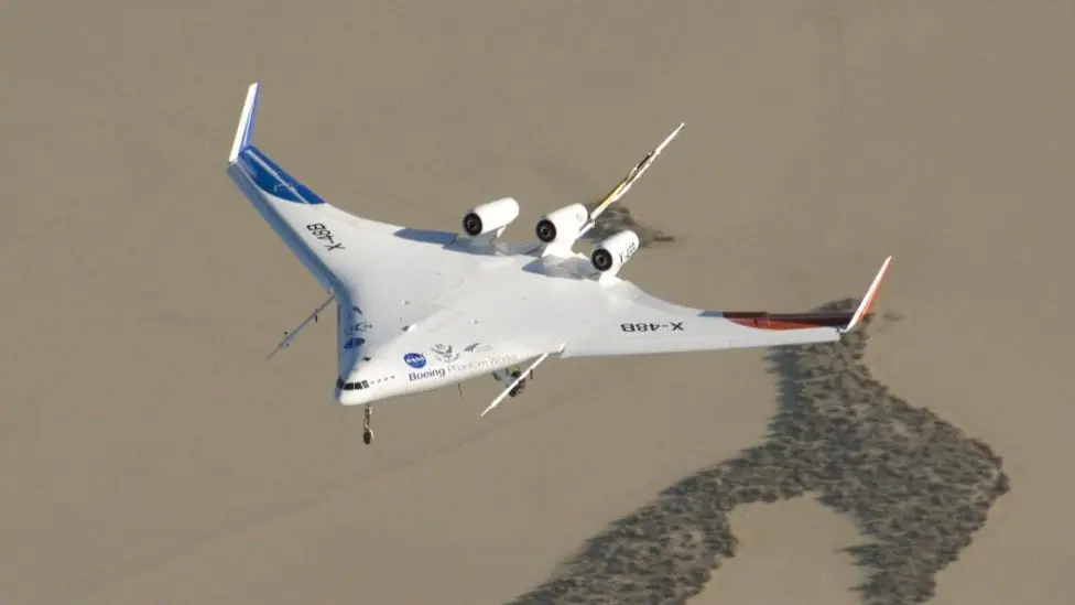 The X-48 flying. The wings and body merge, to create an almost triangular-shaped aircraft.