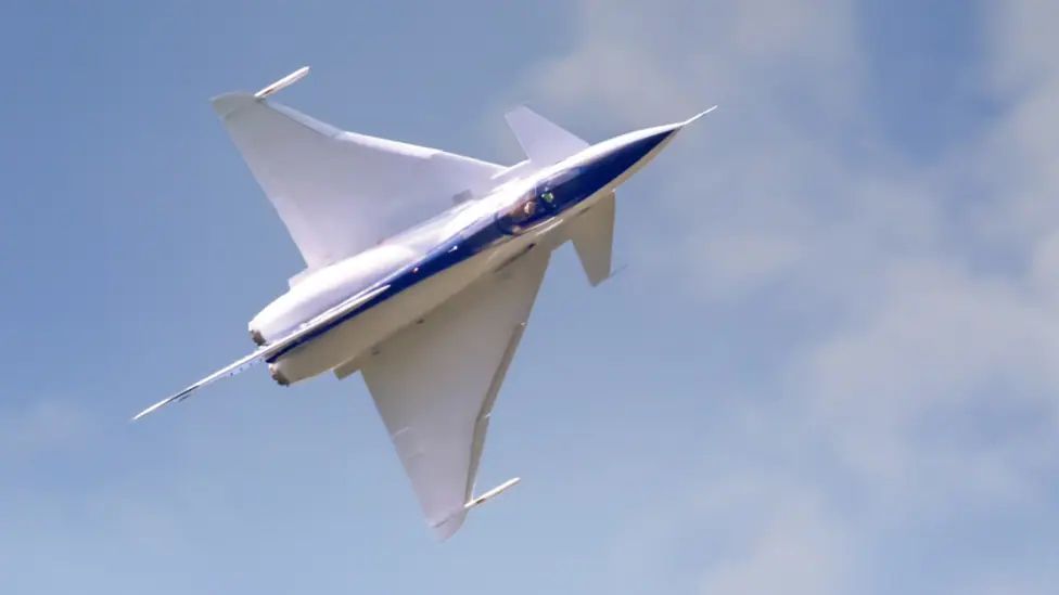The Experimental Aircraft Programme looks like a fighter jet. The body is white with a blue stripe in the middle.