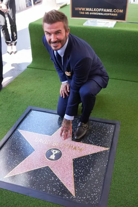 David Beckham poses with his star on the Hollywood Walk of Fame in Los Angeles in June.
