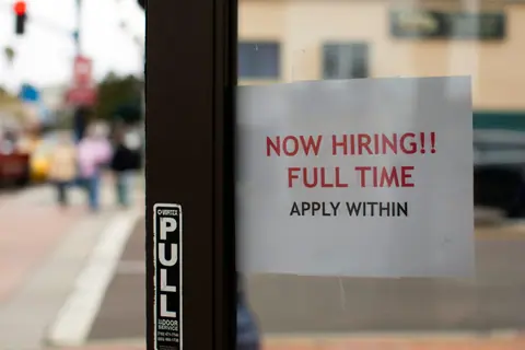 Claims for unemployment benefits drop to 197,000, the lowest since mid-July as layoffs remain rare