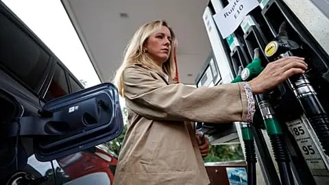 FILE - A customer fills her vehicle at a gas station, in Lille, France, Thursday 17 Sept. 2026.