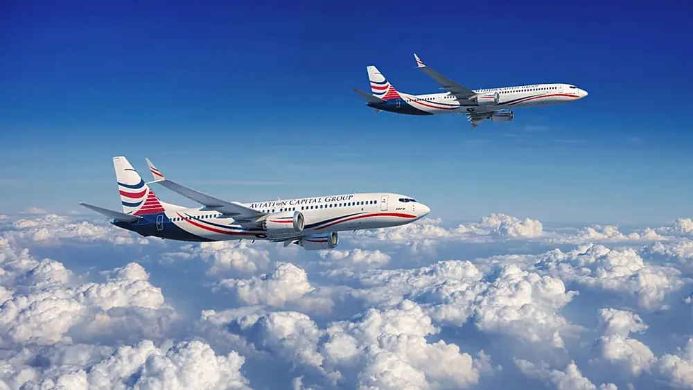 FILE - Two Boeing 737 MAX Aircraft with Aviation Capital Group Livery in Flight. (Photo: Business Wire) / AP