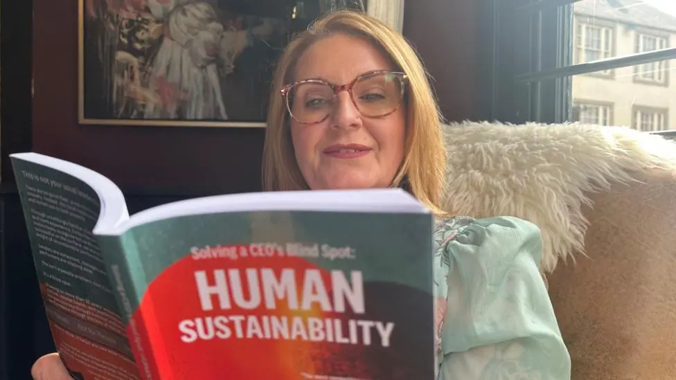 Emily reads her book.