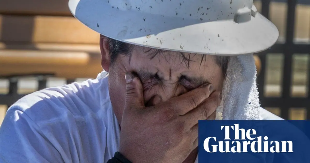 ‘Your body fights to stay cool’: workers toil in record heat as federal rule frozen