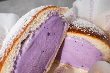 Frosted bun containing purple ice-cream.