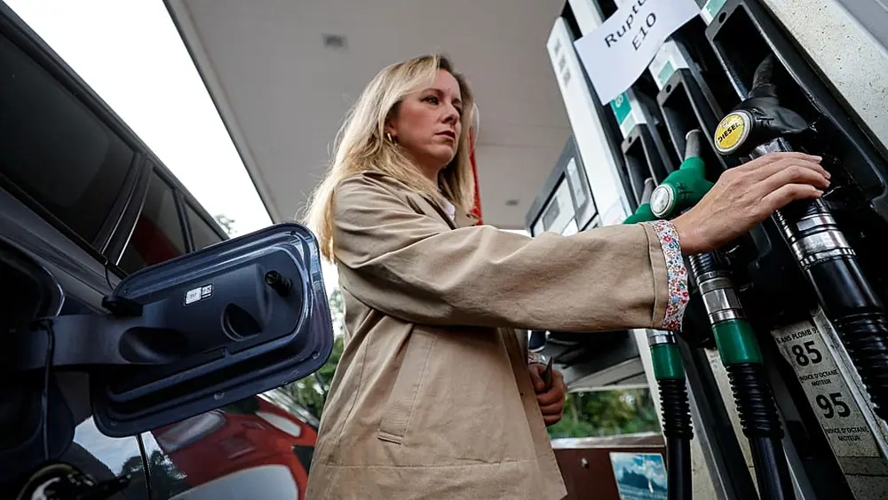 FILE - A customer fills her vehicle at a gas station, in Lille, France, Thursday 17 Sept. 2026.
