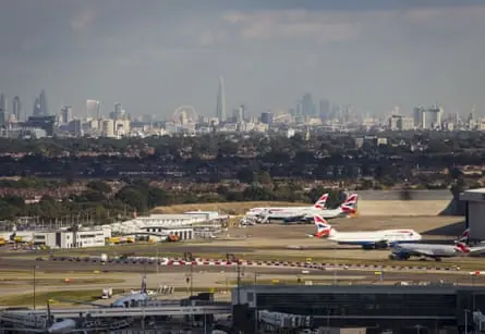 Aircraft at Heathrow airport with the London skyline to the east.