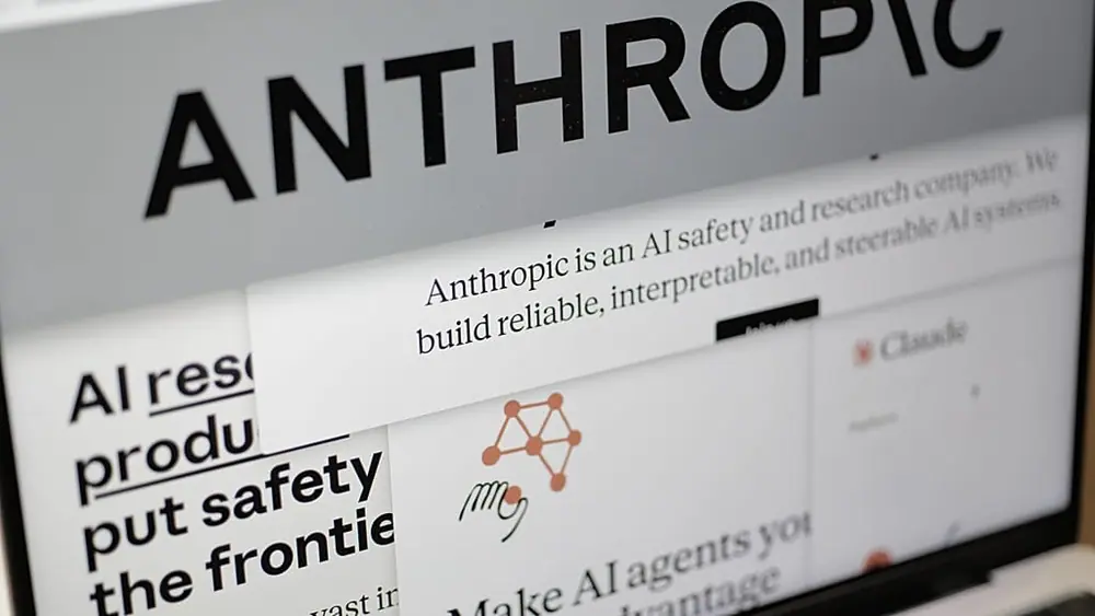 FILE. Pages from the Anthropic website and the company's logo are displayed on a computer screen in New York, 26 Feb. 2026