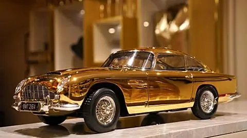 A view of 24-carat gold-plated model of James Bond's Goldfinger Aston Martin DB5, priced at 24,999 pound sterling and one of only seven made in museum quality 1:8 scale by Bri