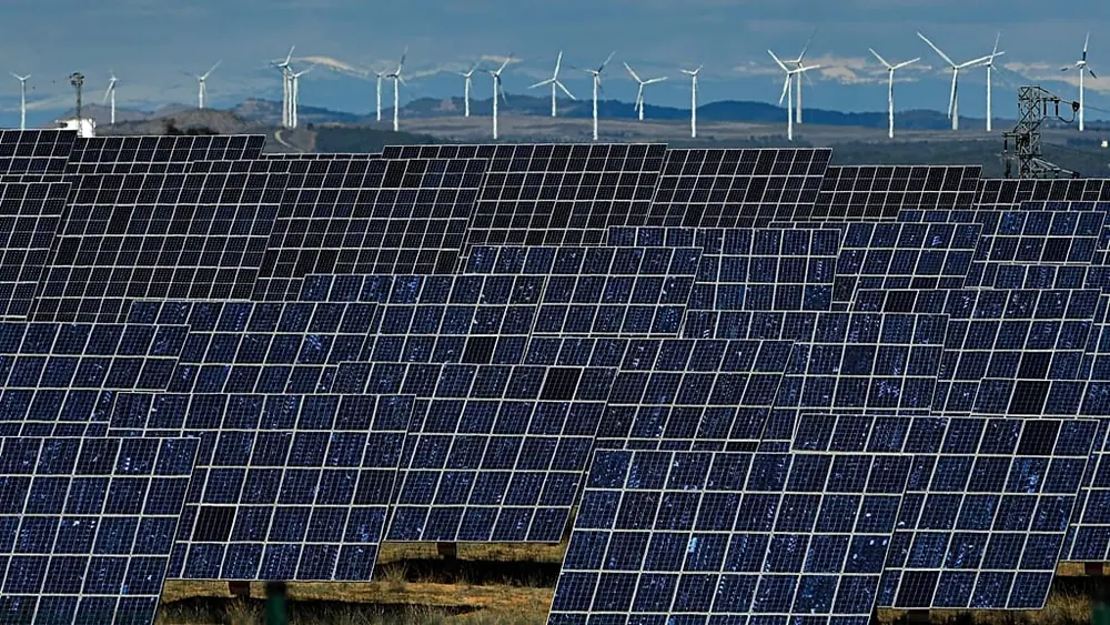 Solar panels work near the small town of Milagro, Navarra Province, northern Spain, Feb. 24, 2023.