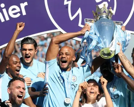 Vincent Kompany lifts the Premier League trophy as Manchester City win the title after draawing 0-0 with Huddersfield Town at the Etihad Stadium, Manchester, 6 May 2018.