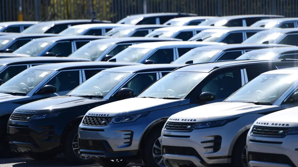Rows of black and silver Land Rover cars