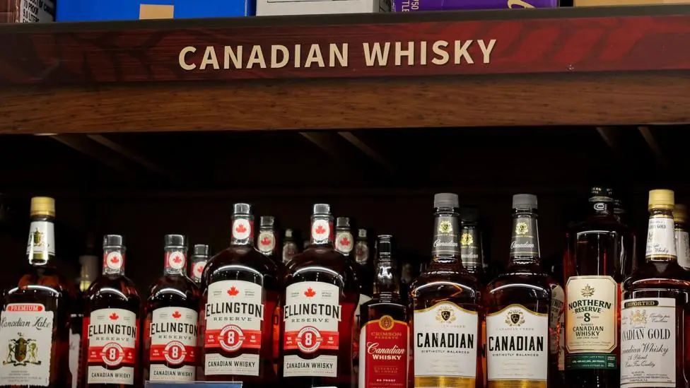 Canadian whiskies are displayed for purchase on a shelf at Total Wine on July 21, 2026 in San Francisco, California.