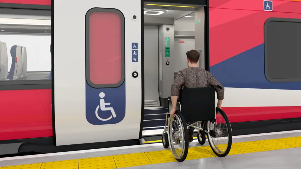 A man in a wheelchair boards a train
