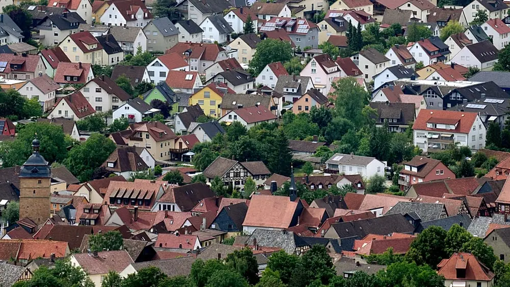 Residential houses in the town of Bad Staffelstein are pictured from the Staffelberg hill in Germany
