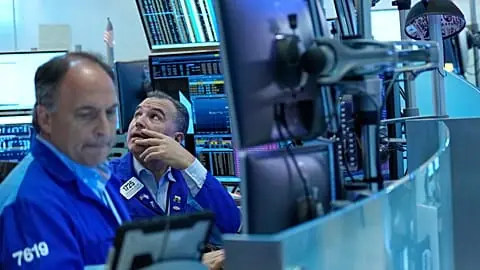 FILE. Christopher Lagana works on the floor at the New York Stock Exchange, 14 Sept. 2026