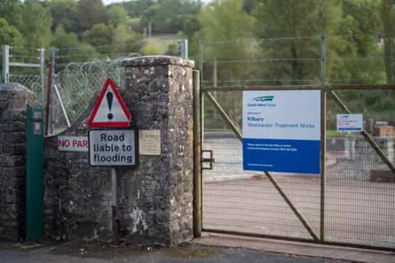 Entrance to the sewage works between stone pillars.