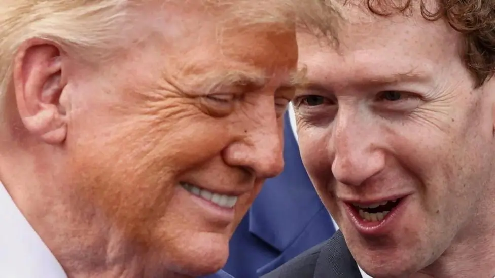President Donald Trump pictured leaning towards Meta boss Mark Zuckerberg whom he is speaking to.