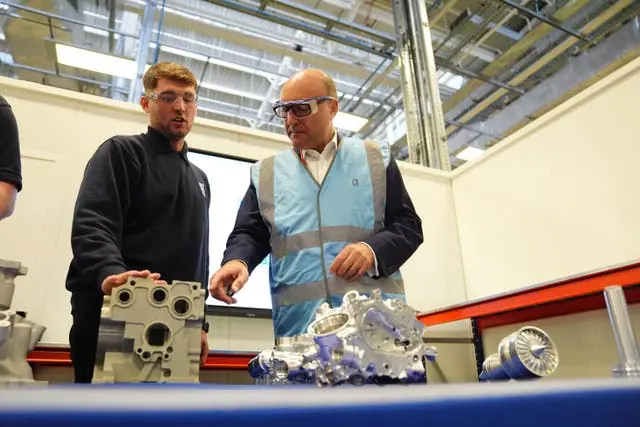 Andrew Griffith (right) speaking to workers during a visit to Rolls-Royce Control Systems in Solihull (Jacob King/PA)