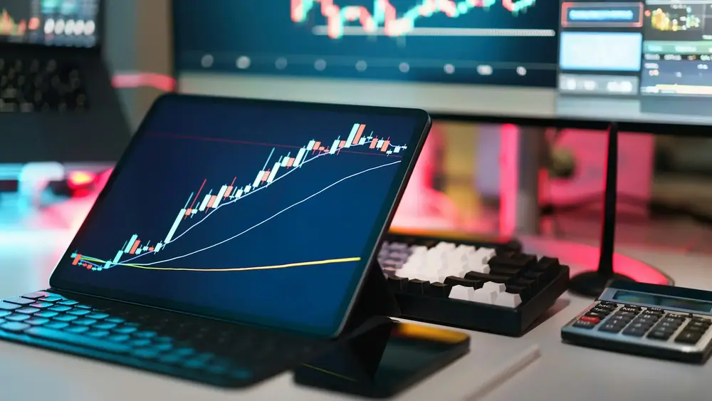 Screens showing trading charts. (Jakub Żerdzicki/Unsplash)