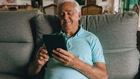 Elderly man with tablet
