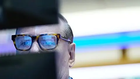 FILE. Patrick King works on the floor at the New York Stock Exchange, 14 Sept. 2026