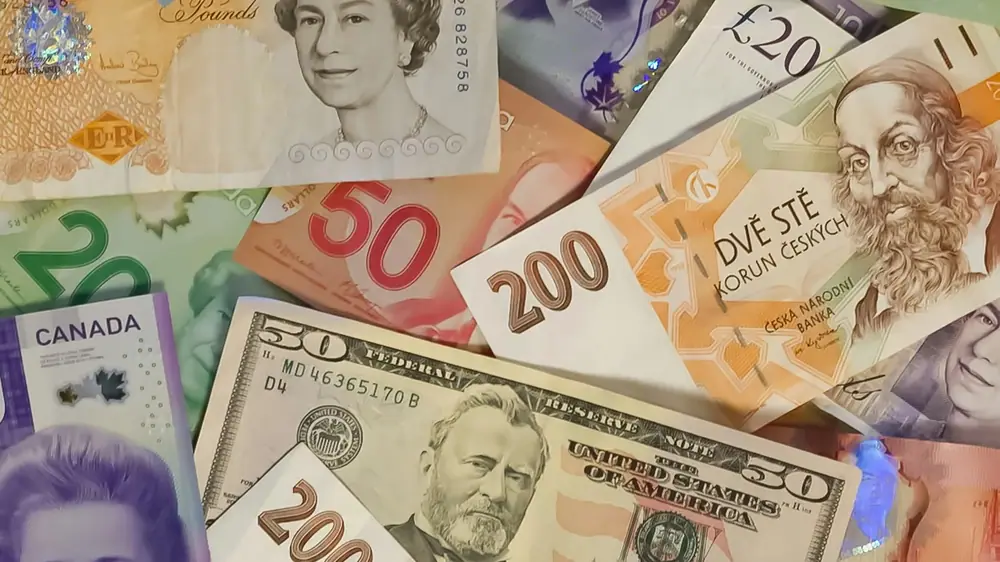 Bank notes from different countries. (John McArthur/Unsplash)
