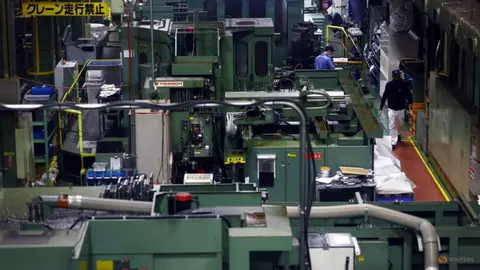 Japan manufacturers' mood hits near 5-year high, service-sector sentiment slumps: Reuters poll