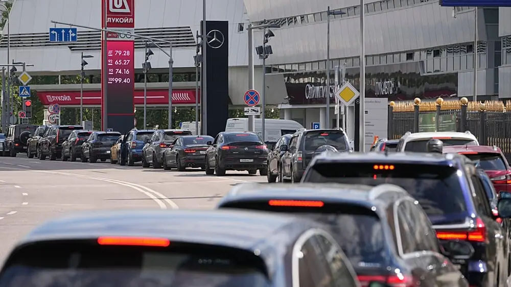Cars line up at a Lukoil gas station in Moscow, Tuesday, June 30, 2026.