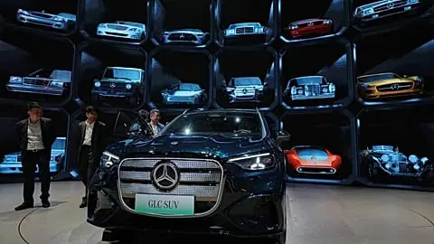 File - Visitors look at a Mercedes latest GLC SUV model showcased at the Auto China 2026, in Beijing, Saturday, 25 April 2026.