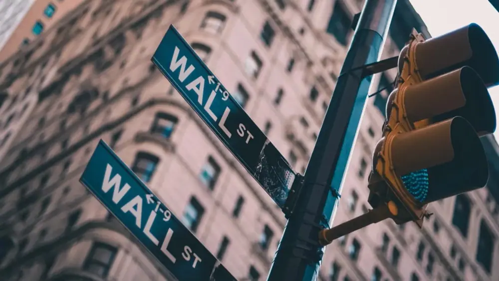 Wall street signs (Lo Lo/Unsplash)