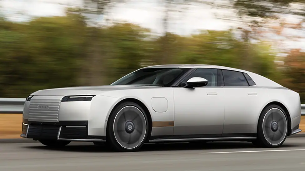 Jaguar's Type 01 on a road. It is a dull silver colour
