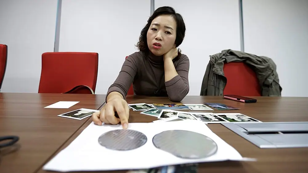 FILE. Samsung chip worker explains how silicon wafers are used in the semiconductor process during an interview in Seoul, South Korea, March 2016