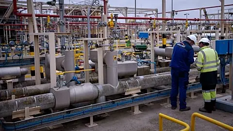 FILE. Operators work at Enagás regasification plant in Barcelona, the largest LNG plant in Europe, 29 March 2022