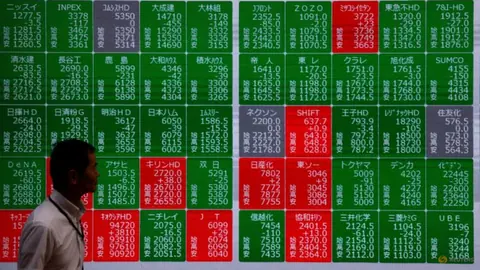 Shares cautious in Asia as earnings loom, oil slips