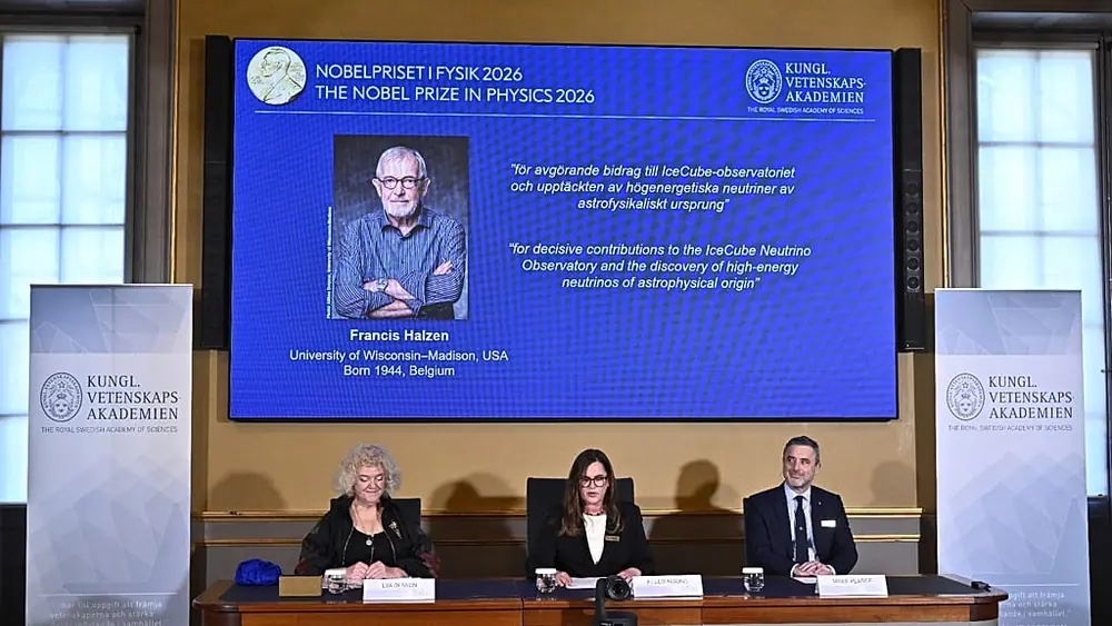 A portrait of Francis Halzen is shown on the screen as the panel announce the recipient of the 2026 Nobel Prize in Physics at the Royal Swedish Academy of Sciences, Stockholm.